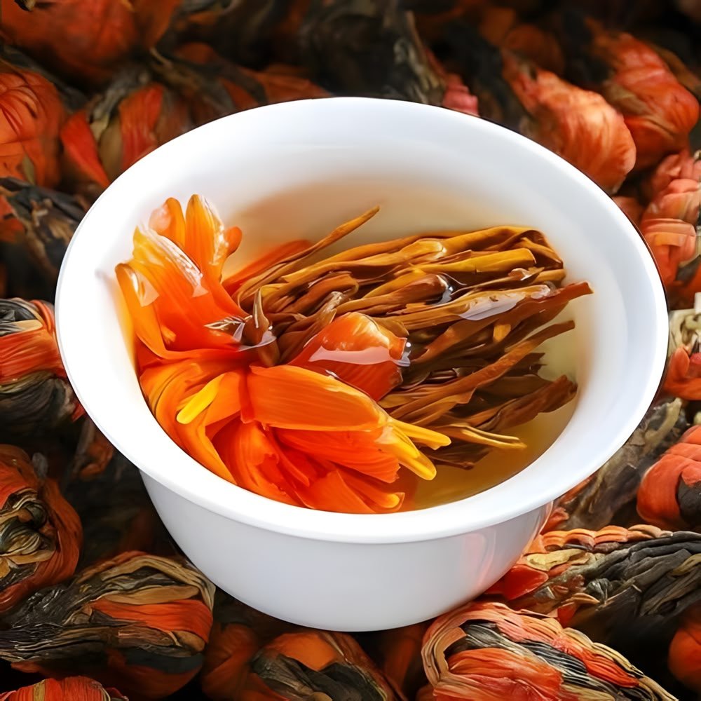 A close-up, top-down view of a white ceramic bowl containing brewed Lily Pagoda tea. The wet, vibrant orange lily petals and long, dark Dianhong black tea leaves are fully unfurled. The background is filled with a texture of many dry, cone-shaped tea bundles.
