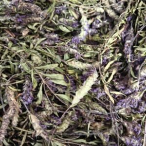 Close-up macro shot of premium dried wild Dongzisu herbs, featuring intricate details of intact purple flower spikes and green leaves, representing its clean highland wild-herb fragrance.